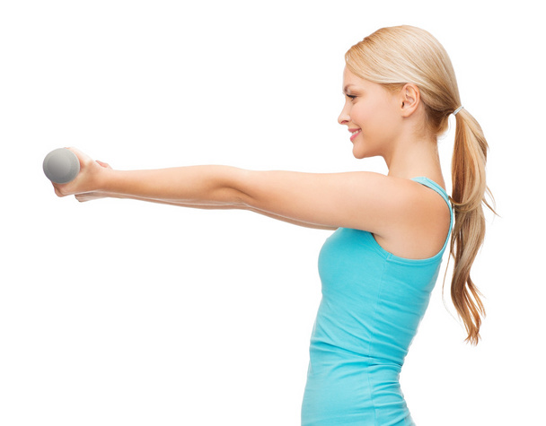Young sporty woman with light dumbbells - Foto, Imagem
