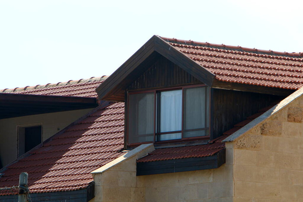 Fragment of a tiled roof. Architectural details of housing in Israel  - Photo, Image