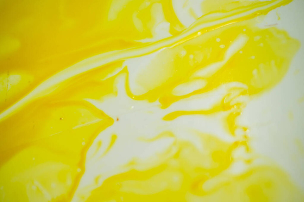 Yellow background. Yellow abstraction.Spilled ink for refilling cartridges. - Photo, Image