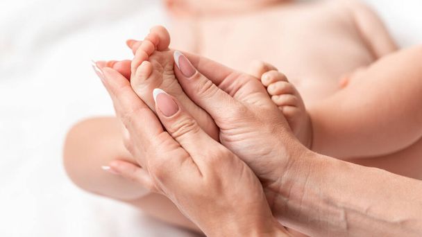 Mother makes massage for happy baby, Masseur massaging little baby's foot. - Fotoğraf, Görsel