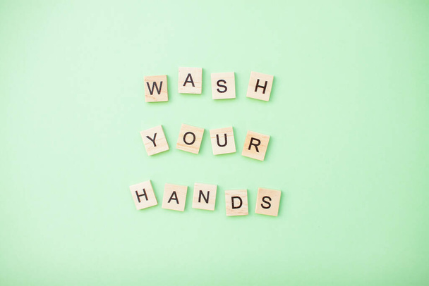 inscription from wooden blocks wash your hands - Фото, изображение