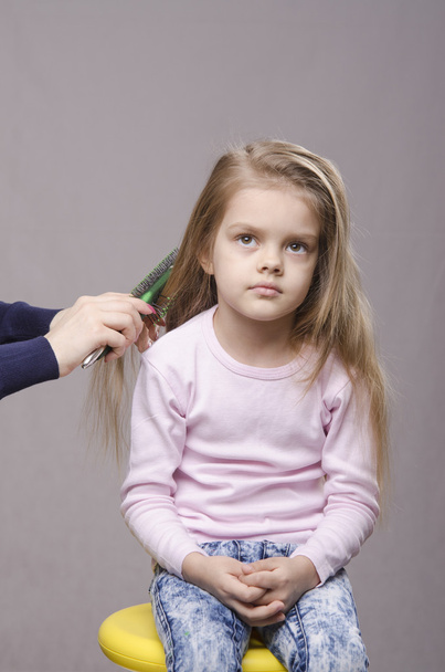 Hairdresser brushing her long hair girls - Photo, Image