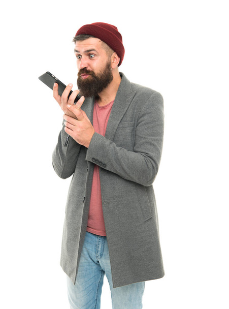 Mobile call concept. Important conversation. Man bearded hipster hold mobile phone white background. Difficulties mobile communication. Hipster smartphone call friend. Stylish guy use mobile phone - Фото, изображение