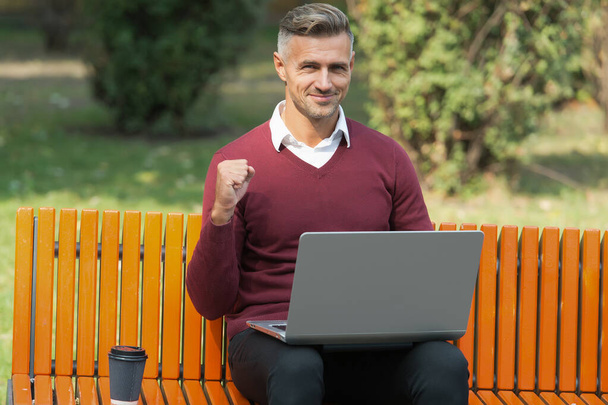 successful business man working on computer with morning coffee outdoor, success - Foto, Bild