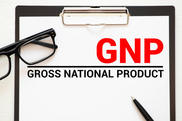PNB Produit national brut acronyme écrit dans un cahier sur fond de bois. - Photo, image