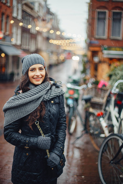 female tourist walking around and exploring Amsterdam - Foto, Imagen