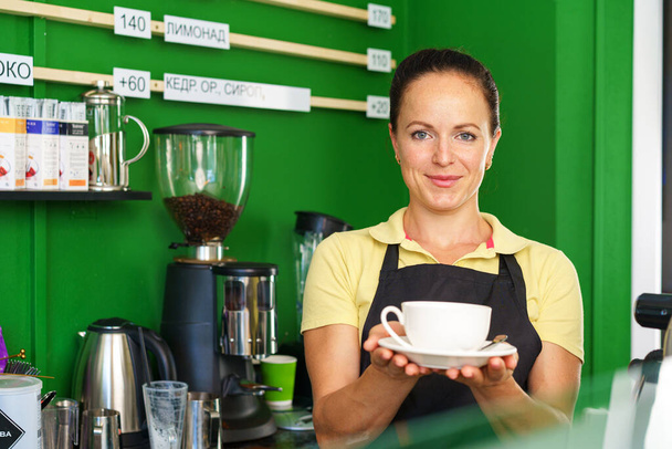 Portrait of a woman barista in coffee shop - Fotografie, Obrázek