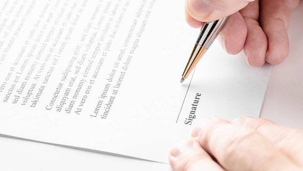 Businessman is signing a contract, business contract details. - Фото, зображення
