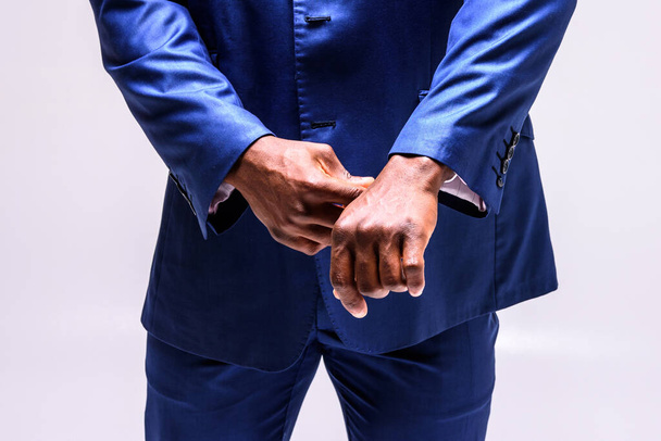 Male African businessman in a suit. Close up hands - Фото, зображення