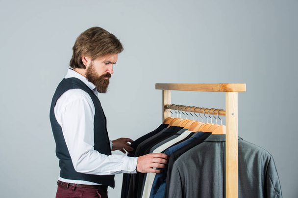 Suits jacket blazers on rail fashion boutique customer choosing, choosing one concept - Foto, imagen