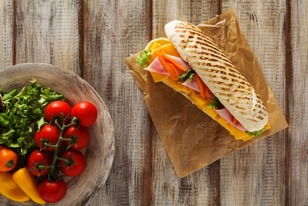 Traditional Italian sandwich with ham and cheese served warm. - Zdjęcie, obraz
