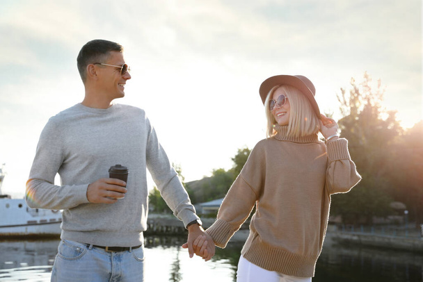 Couple in stylish sweaters on city pier - Zdjęcie, obraz