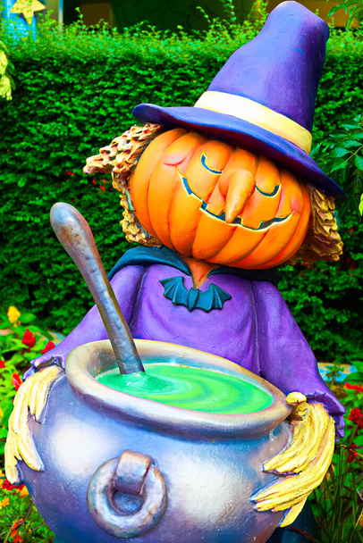 Cute Halloween witch statue made of pumpkins.Halloween seasons.Jack o lantern. - Photo, Image