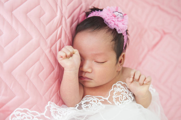 Sleeping newborn baby in a wrap - Valokuva, kuva