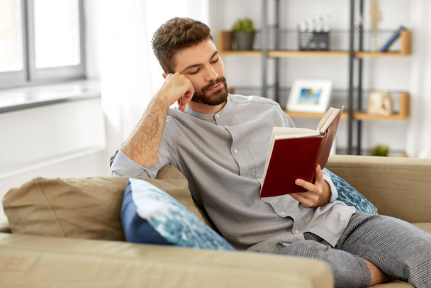 man reading book at home - Photo, Image