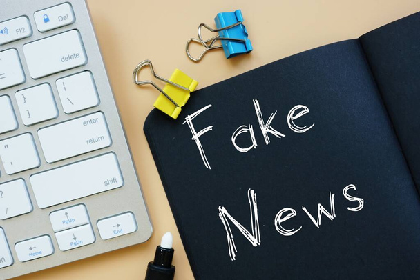 Business concept about Fake News with phrase on the page. - 写真・画像