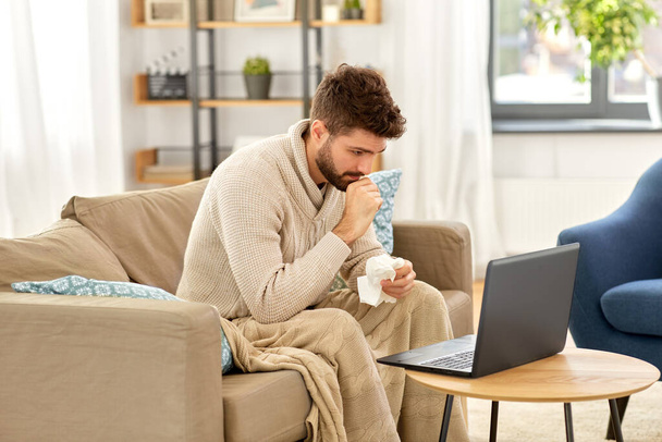 sick man having video call on laptop at home - Φωτογραφία, εικόνα