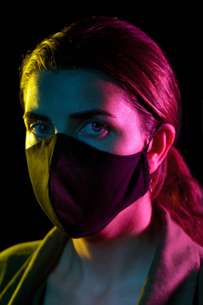 young woman wearing reusable protective mask - Foto, imagen