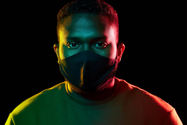 african american man wearing black reusable mask - Foto, imagen