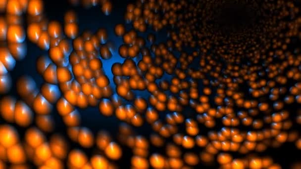 Massa van oranje lichamen of ballen in een cilindertunnel in de donkere ruimte - Video