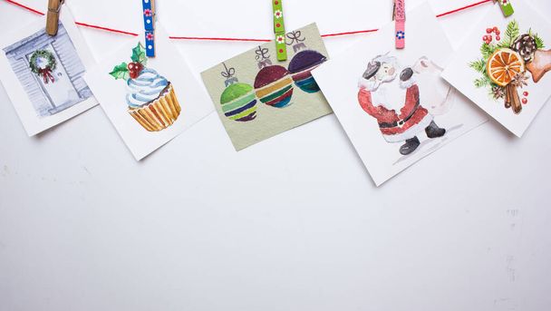 Χριστουγεννιάτικες νερομπογιές που απομονώνονται σε ένα λευκό: cupcake, ελάφι, πορτοκάλι, μπισκότο. - Φωτογραφία, εικόνα