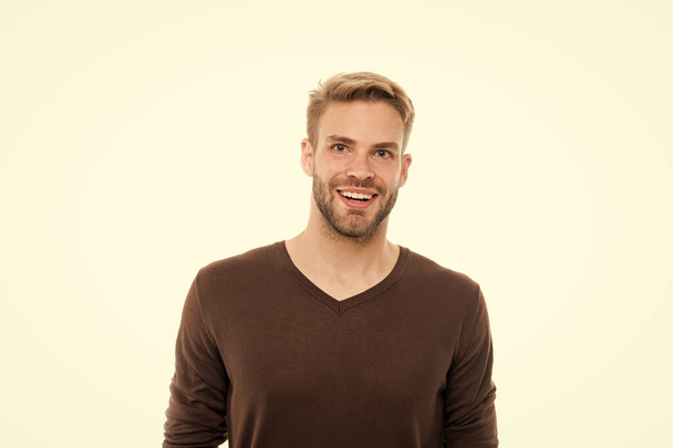 Good mood. Positive emotions. Smiling man white background. Handsome man. Unshaven facial hair and stylish haircut. Caucasian man in casual style. Fashion and style. Menswear shop. Kindly smiling - 写真・画像