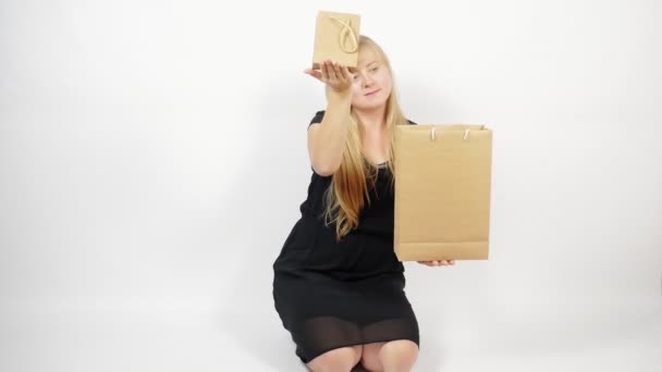 Portrait of a girl with white hair with packages. Sales. Black Friday.  - Footage, Video