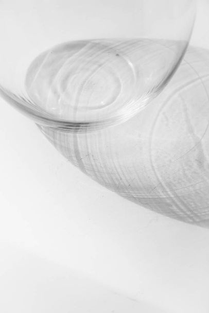 Glass vase, isolated on white. Beautiful minimalistic still life, shadows and light - Photo, Image