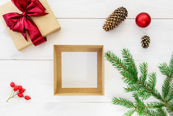 Empty box for a gift on a wooden table. Gift for Christmas and New Year. - 写真・画像