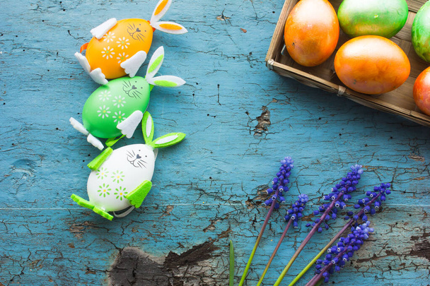 Colored Easter eggs on wooden table background - Foto, Imagem