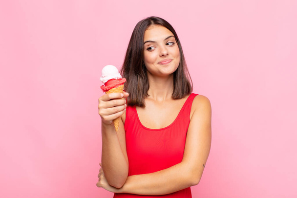 young pretty woman with an ice cream cone. summer concept - Fotó, kép