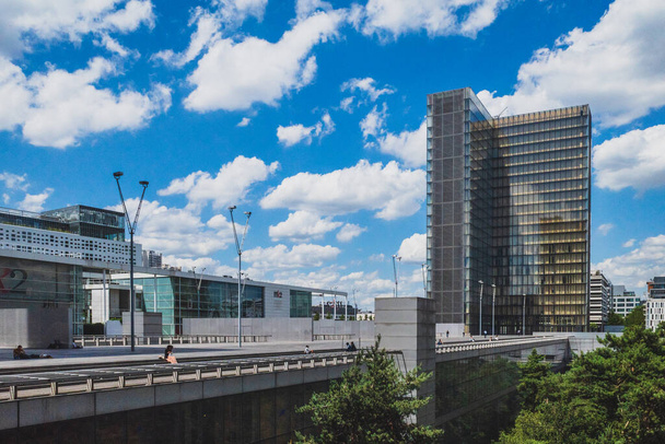 June 14, 2019 - Paris, France: Buildings and architecture of French National Library under blue sky and clouds - Photo, Image