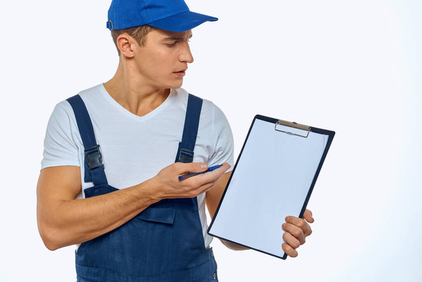 Working man in uniform documents delivery service courier - Fotografie, Obrázek