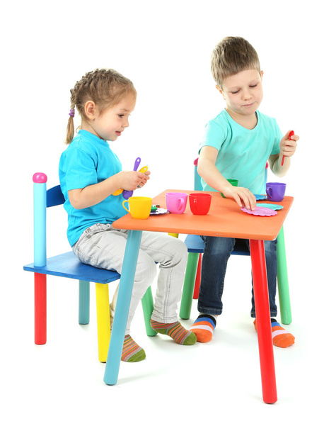 Little children playing with colorful tableware isolated on white - Zdjęcie, obraz