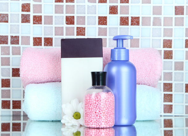 Cosmetics and bath accessories on mosaic tiles background - Фото, изображение