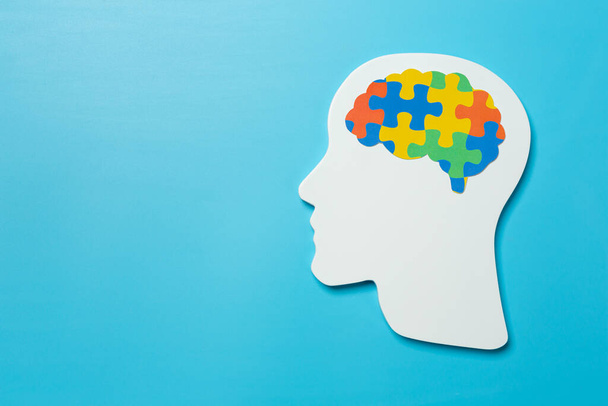 World Mental Health Day; jigsaw brain symbol on blue background. - Zdjęcie, obraz