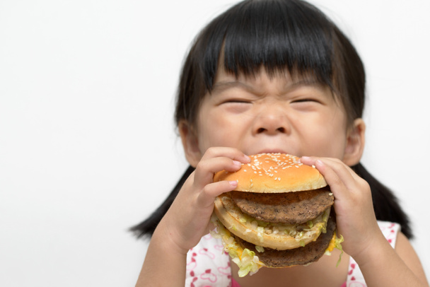 Enfant manger un gros hamburger
 - Photo, image