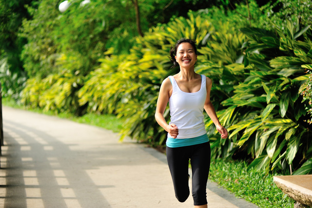 Asian woman jogging at park - 写真・画像