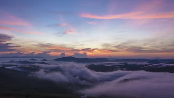 Beautiful morning sunrise time lapse and moving of clouds over the valley. Taken at RANAU PARAGLIDING PARK, SABAH BORNEO. time lapse motion pan right - Footage, Video