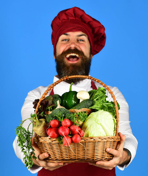 Man with beard on blue background. Vegetarian diet concept - Photo, Image