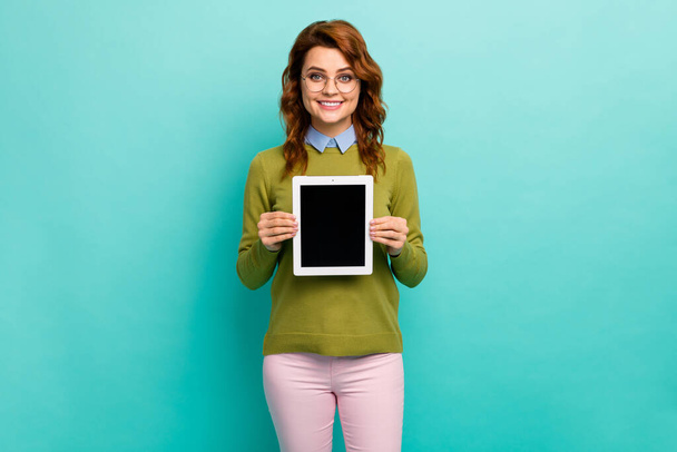 Portrait of her she nice attractive content cheerful cheery wavy-haired girl holding in hands new tablet product isolated on bright vivid shine vibrant teal turquoise color background - Φωτογραφία, εικόνα