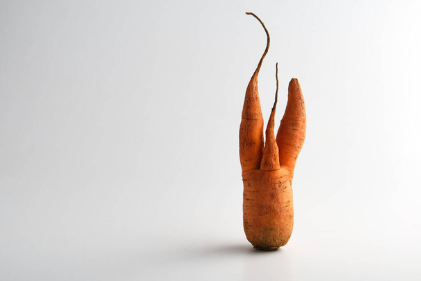 ugly food carrot on a white background - Foto, imagen