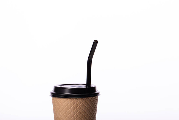 Craft coffee paper cup with eco-friendly glass straw, isolated white background - Photo, Image