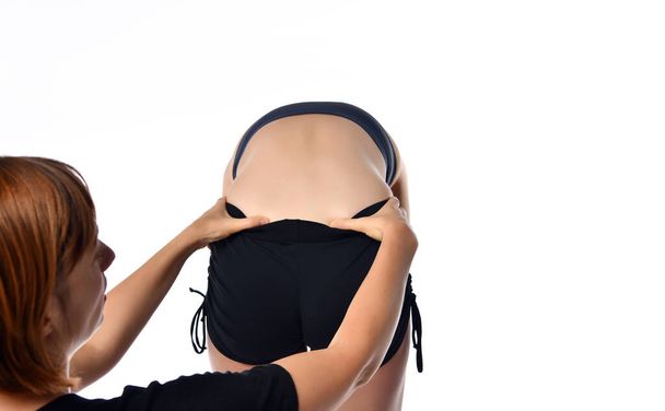 Professional masseur woman doing therapeutic back massage. - Photo, Image