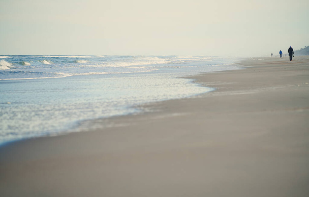 Incidental people walking along the beach of Atlantic Ocean. USA - Photo, Image