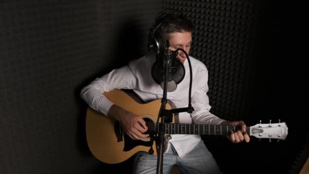Young musician that is recording new song in a modern sound studio. - Footage, Video