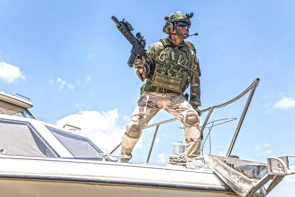 Army special forces soldier on speed boat bow - Photo, Image
