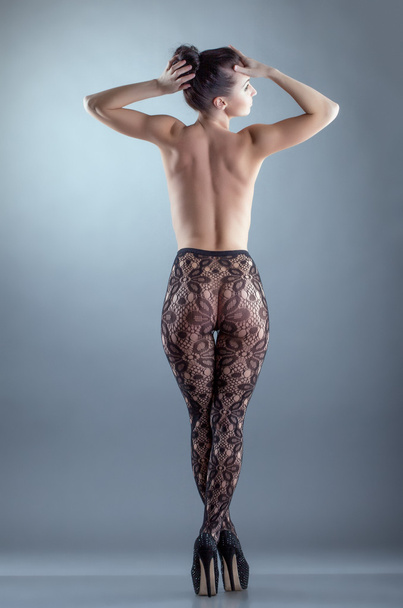 Naked girl posing in black translucent pantyhose - Fotoğraf, Görsel