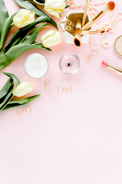 Female workspace with tulip flowers bouquet, golden accessories, diary, on pink background. Flat lay womens office desk. Top view feminine background - Fotoğraf, Görsel