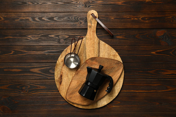 Set of modern cooking utensils on brown wooden table, top view - Фото, изображение